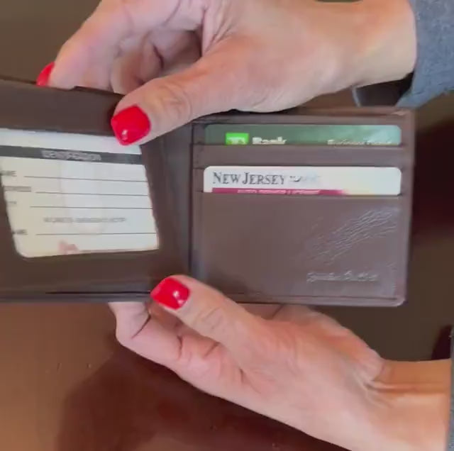 Video showing the bifold wallet opening to reveal card slots and flip ID window